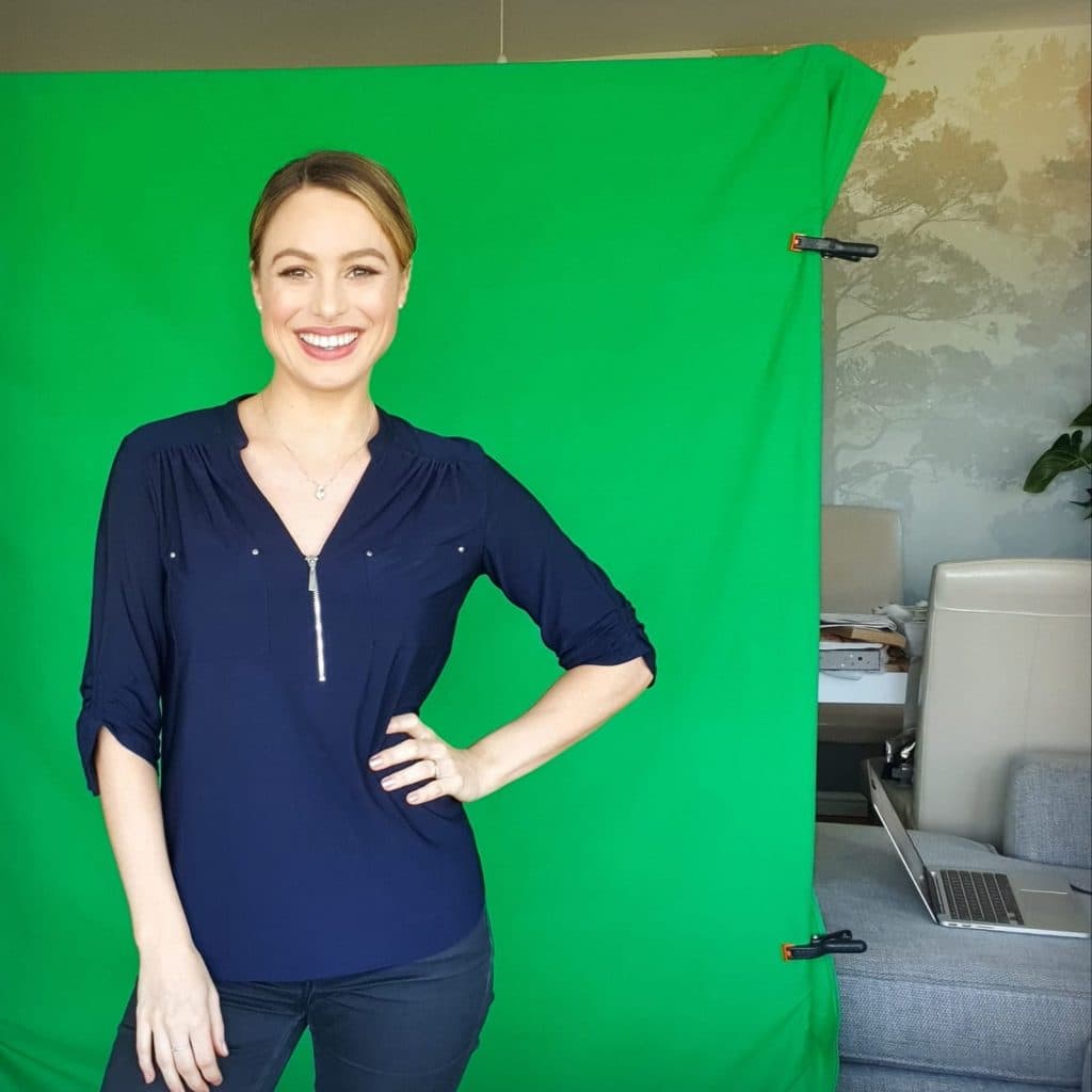 Presenter Hannah Jackson presenting in front of green screen